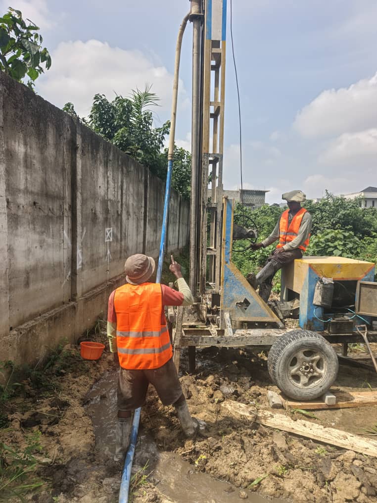 Operator running a rig alongside a boundary wall